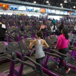 Women hitting the treadmills at Planet Fitness for their exercise routine
